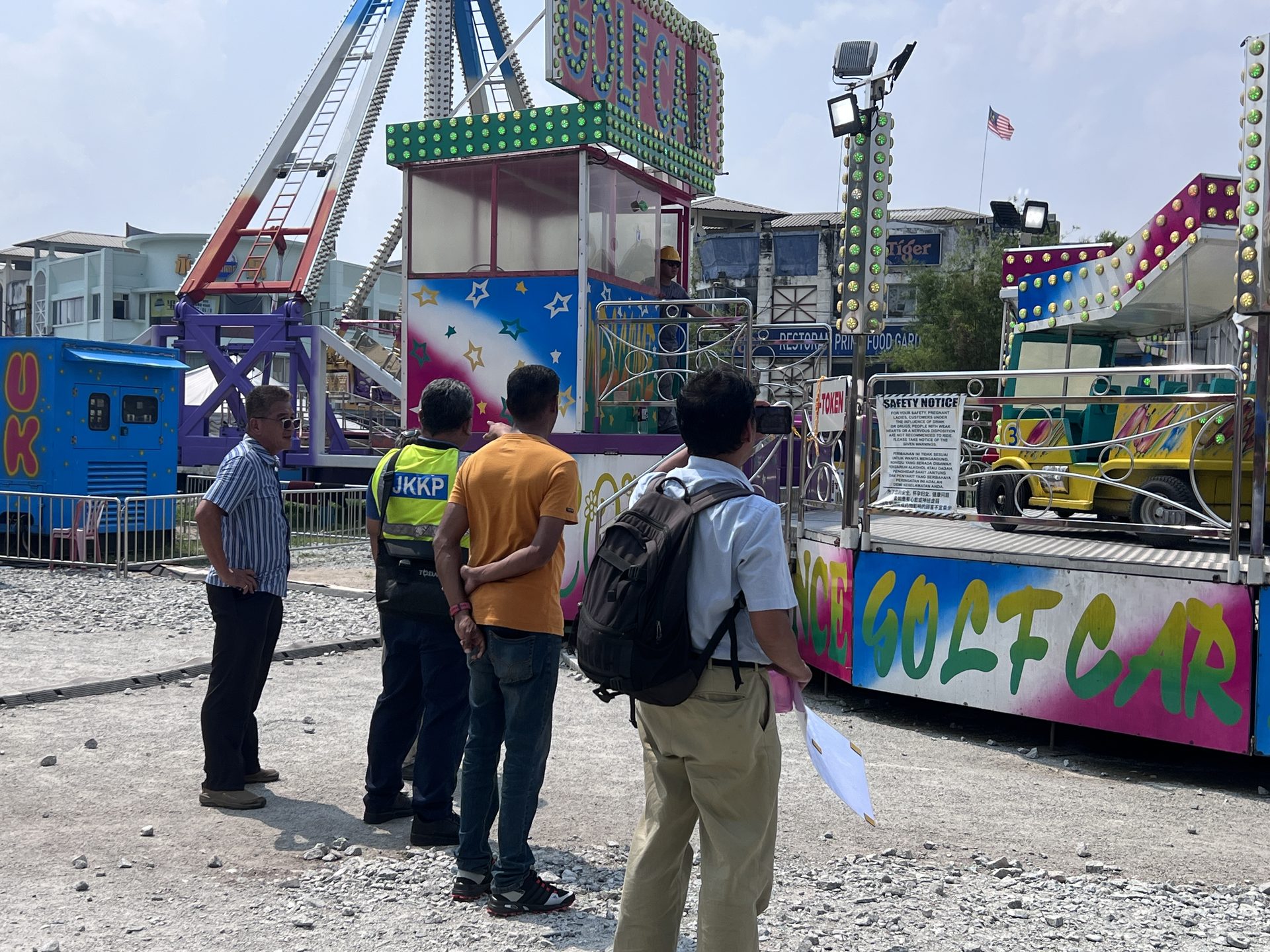Inspection team checking ride and safety notice area