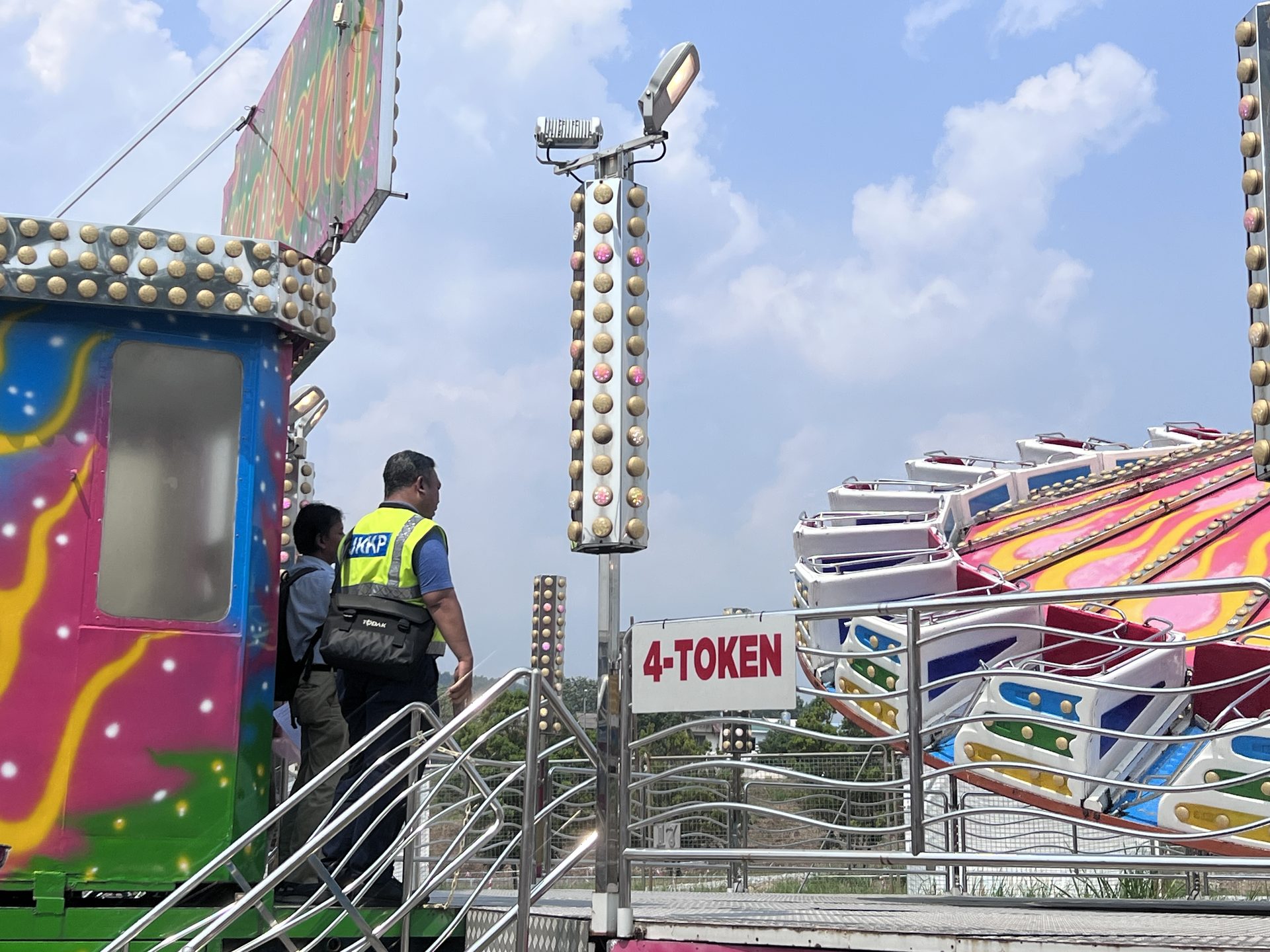 Inspection personnel checking ride area at UK Fun Park